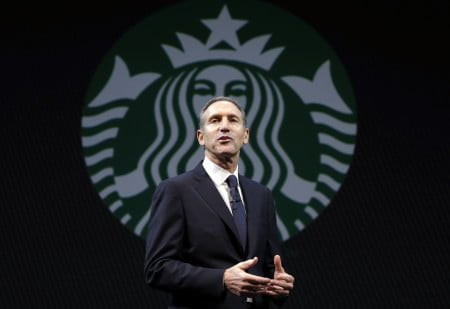 Starbucks CEO Howard Schultz speaks at the company's annual shareholders meeting, Wednesday, March 20, 2013, in Seattle, Wash. (AP Photo/Ted S. Warren)
